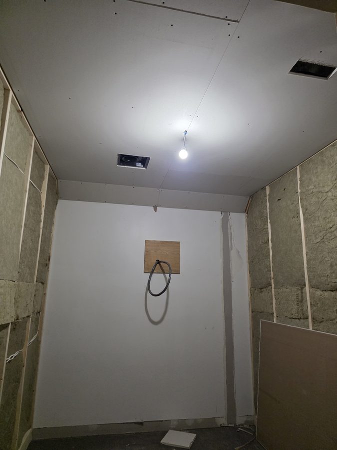 Chinook Glow drywall — corridor with drywall going up on left wall