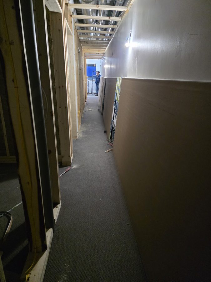 Chinook Glow drywall — corridor with drywall and ductwork