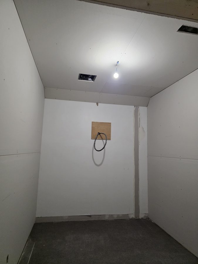 Chinook Glow drywall — tanning room walls boarded, buck booster feed