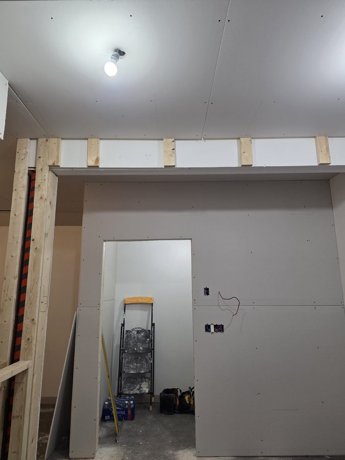 Chinook Glow drywall — reception framing with door opening cut