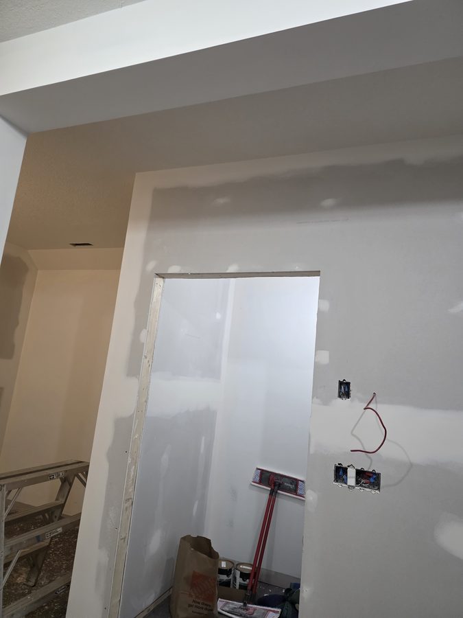 Chinook Glow drywall complete — reception area with pass-through window