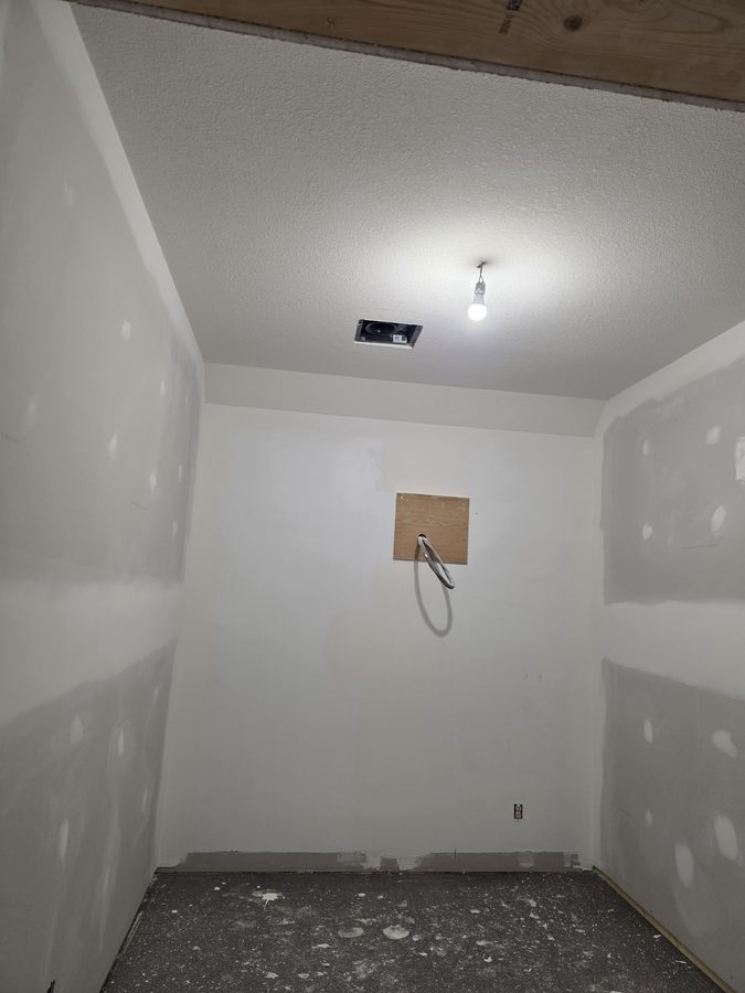 Chinook Glow drywall complete — service room primed