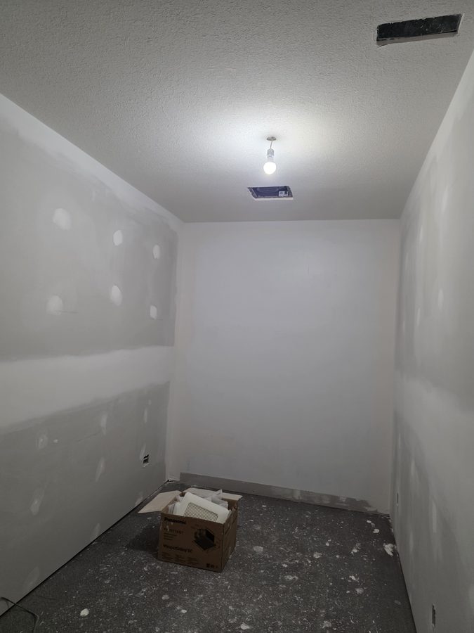 Chinook Glow drywall complete — sauna room primed and ready