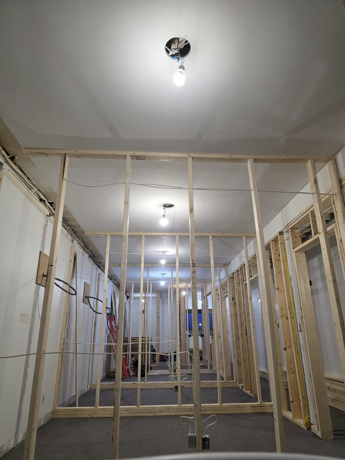 Chinook Glow electrical rough-in — corridor view with wiring overhead