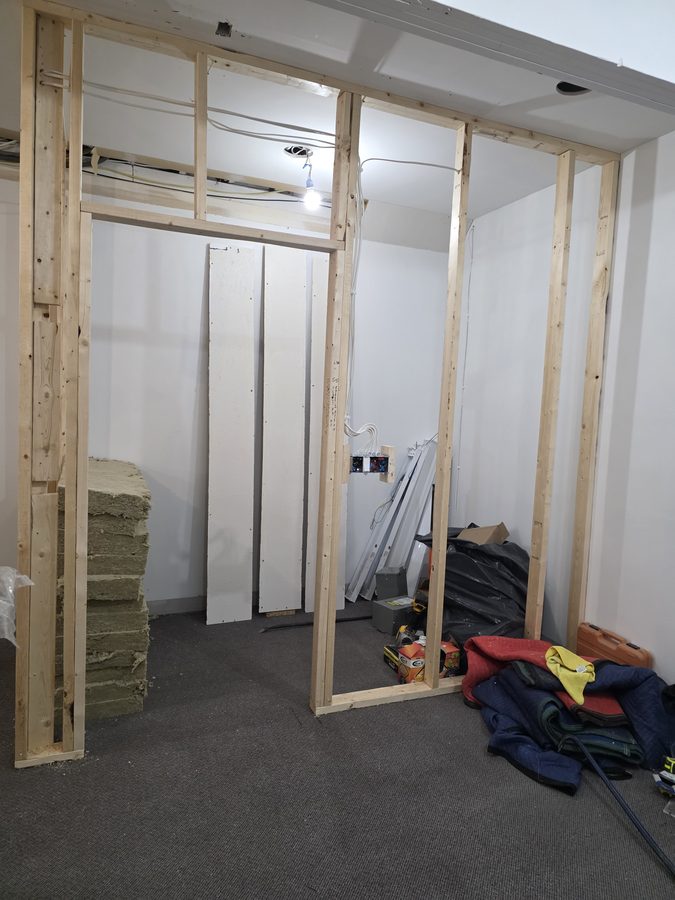 Chinook Glow electrical rough-in — insulation and drywall staged