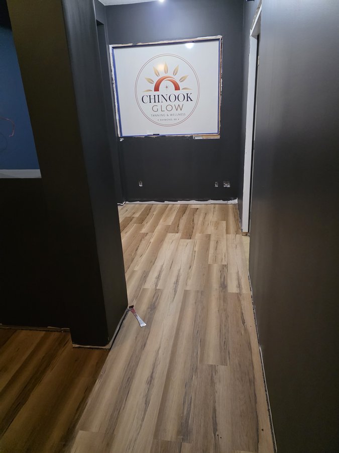 Chinook Glow flooring — LVP reaching the reception end