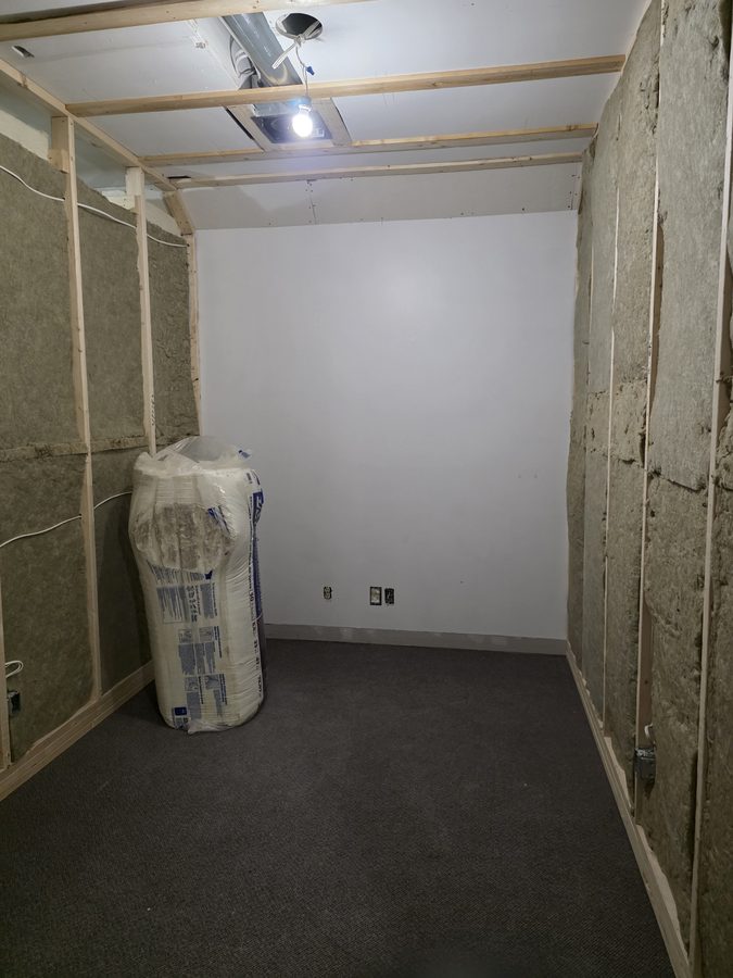 Chinook Glow HVAC — duct work overhead with insulation starting