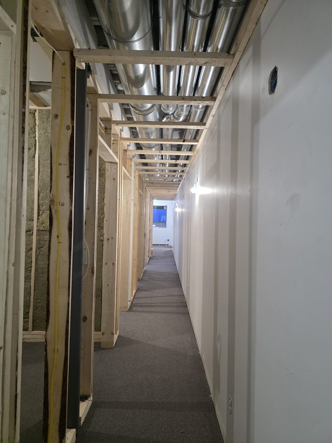 Chinook Glow insulation — full corridor with duct run and drywall