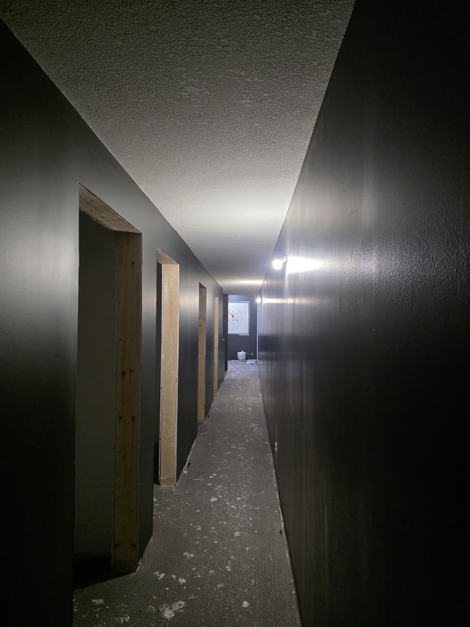 Chinook Glow paint — corridor with service room doorways framed