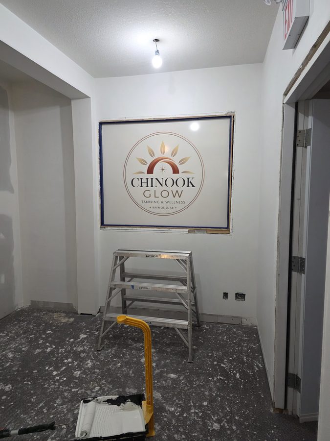 Chinook Glow interior reception wall logo decal — 142 Broadway Raymond AB